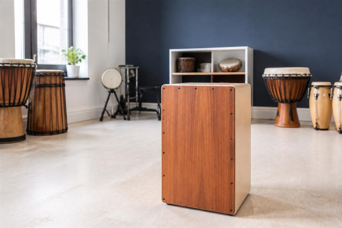 Wooden cajón and hand percussion set near the window at Illuminvok